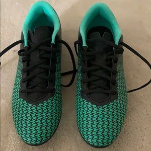 Green and black underarmour soccer cleats. Size 7